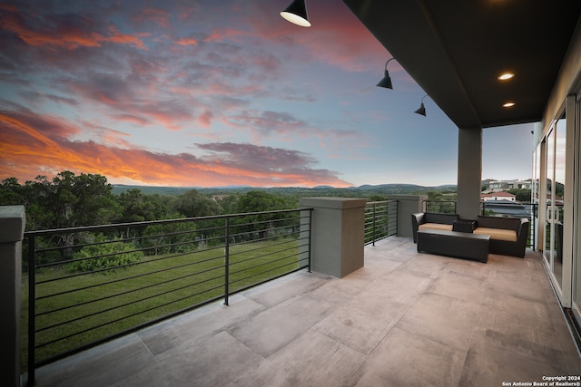 view of balcony at dusk