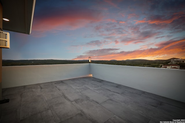 patio terrace at dusk with a balcony