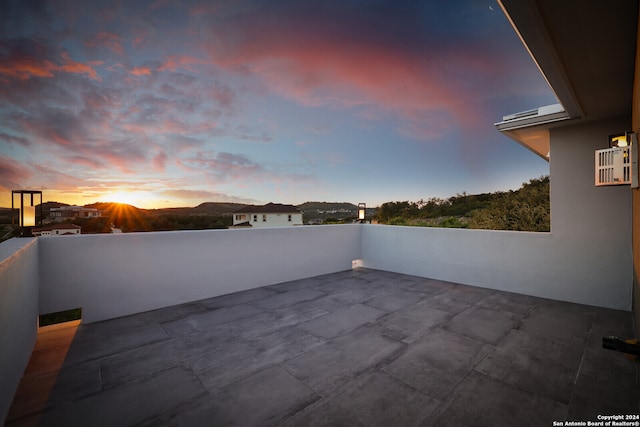 view of patio terrace at dusk