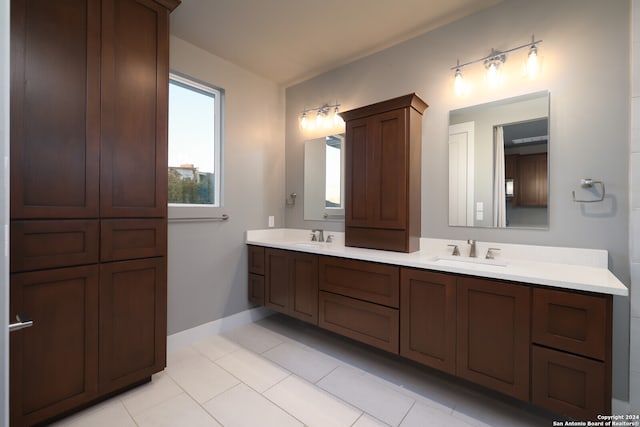 bathroom with vanity and tile patterned floors