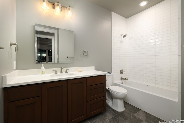 full bathroom featuring vanity, toilet, and tiled shower / bath combo