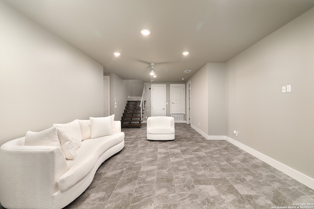 unfurnished living room featuring ceiling fan