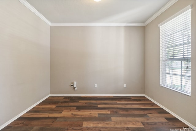 unfurnished room with dark wood-type flooring and ornamental molding