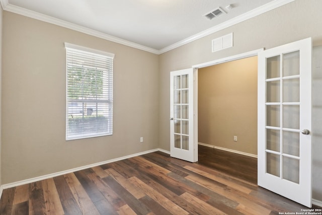 unfurnished room featuring crown molding, french doors, and dark hardwood / wood-style flooring