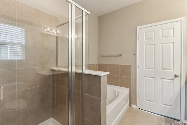 bathroom featuring separate shower and tub and tile patterned floors