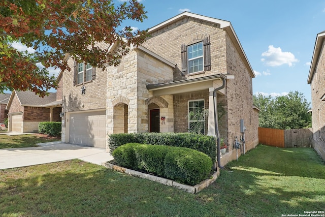 view of front of home with a garage and a front lawn