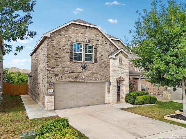 view of front of house with a garage and a front yard