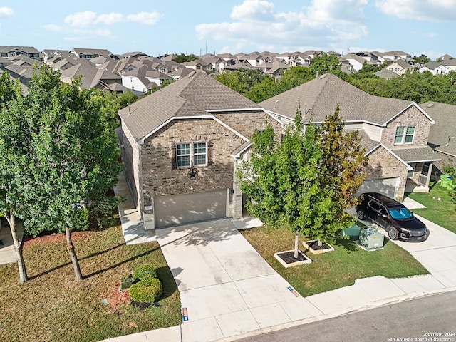 view of front of house featuring a front yard and a garage