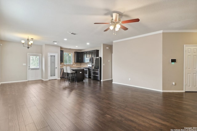 living room featuring ceiling fan with notable chandelier, crown molding, and dark hardwood / wood-style floors