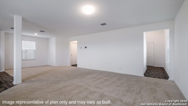 empty room with carpet flooring