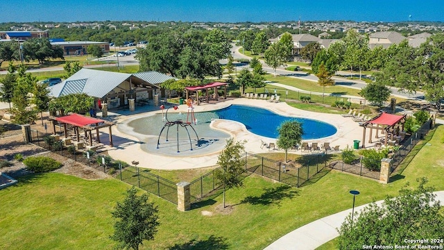 view of swimming pool with a gazebo, a playground, a patio, and a lawn