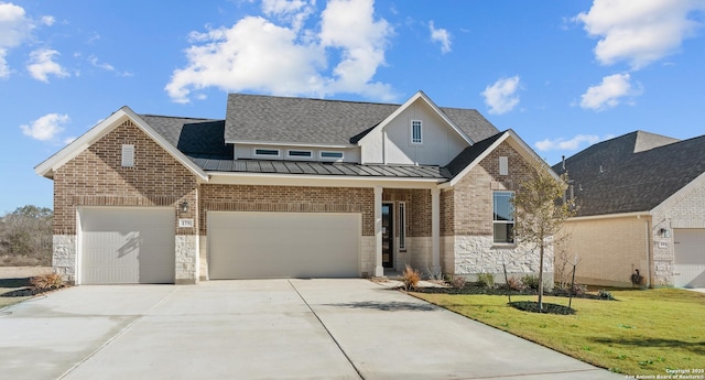 view of front of home with a garage and a front yard