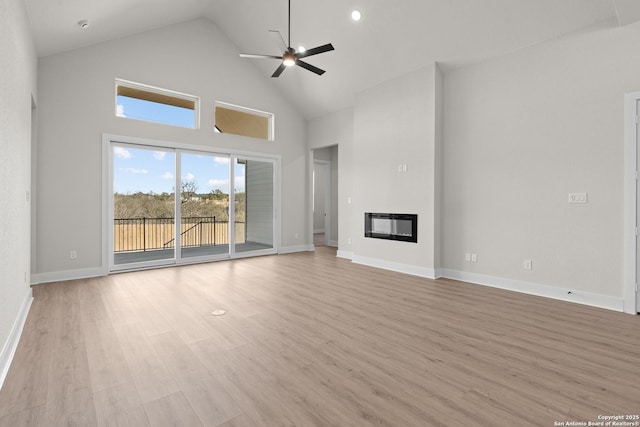 unfurnished living room featuring ceiling fan, high vaulted ceiling, and light hardwood / wood-style floors