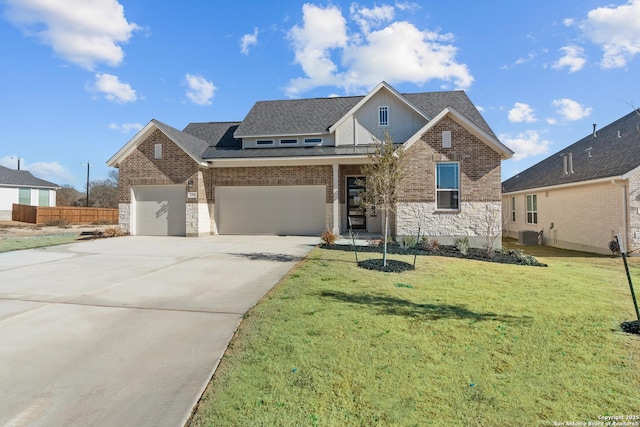 view of front of property featuring driveway, brick siding, an attached garage, and a front lawn