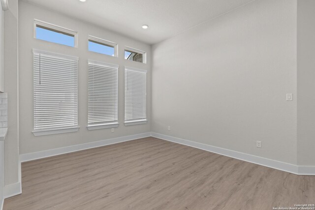 unfurnished room featuring light hardwood / wood-style floors