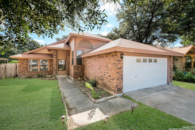 single story home with a garage and a front yard