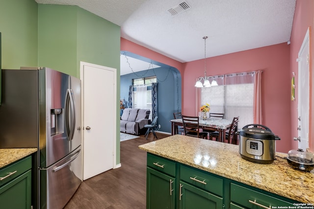 kitchen featuring a textured ceiling, light stone countertops, stainless steel fridge with ice dispenser, dark wood-type flooring, and green cabinetry