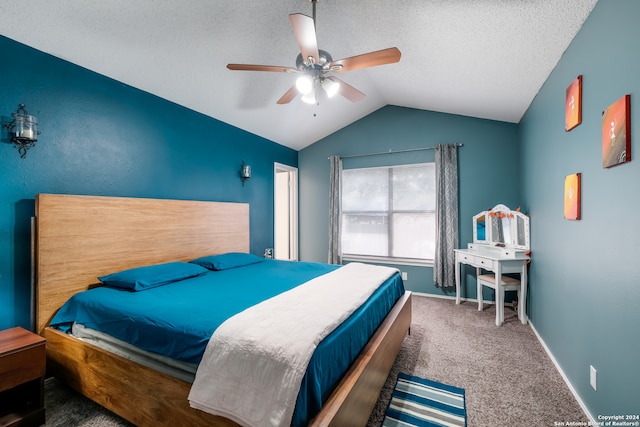 bedroom featuring a textured ceiling, ceiling fan, carpet floors, and vaulted ceiling