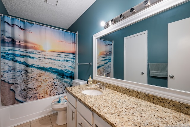 full bathroom with a textured ceiling, vanity, shower / bath combination with curtain, toilet, and tile patterned floors