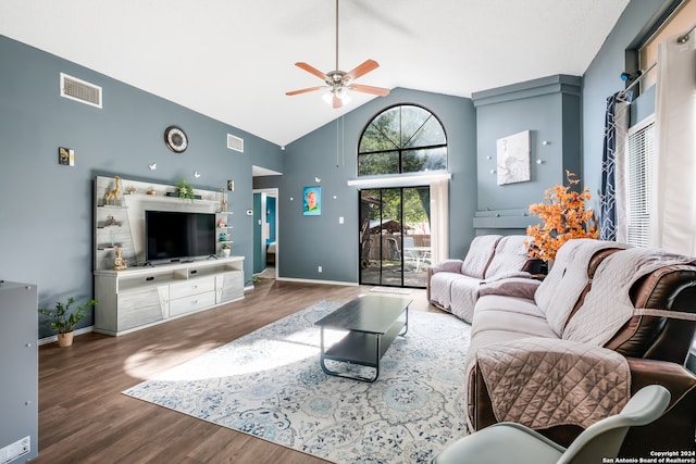 living room with ceiling fan, hardwood / wood-style floors, and high vaulted ceiling