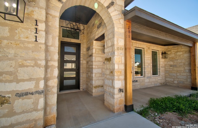 property entrance with a porch