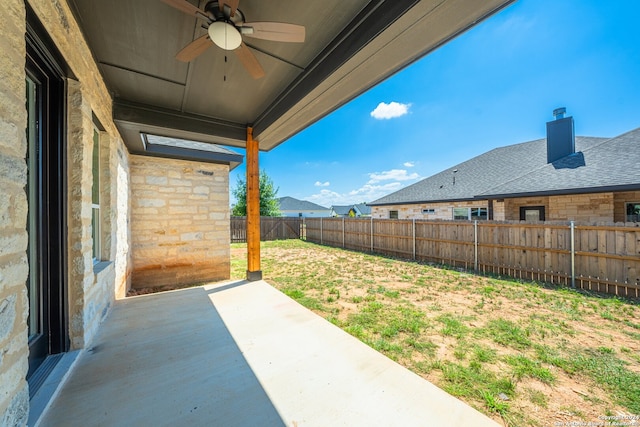 view of yard with a patio and ceiling fan