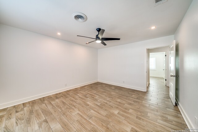 unfurnished room featuring ceiling fan and light hardwood / wood-style floors