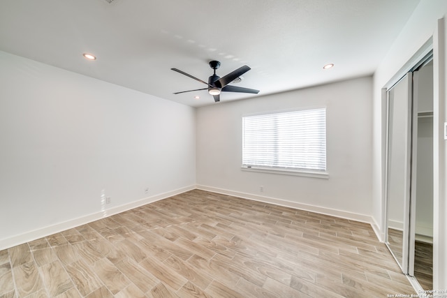 unfurnished bedroom with light wood-type flooring and ceiling fan