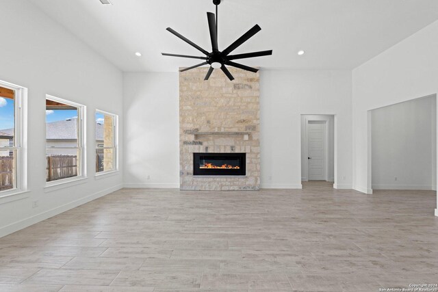 kitchen featuring sink, hanging light fixtures, wall chimney range hood, stainless steel appliances, and dark brown cabinetry