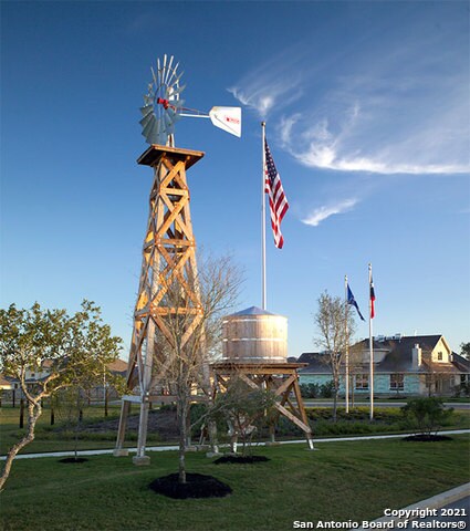 view of property's community with a lawn