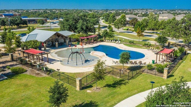 view of pool with a gazebo, a yard, a playground, and a patio area