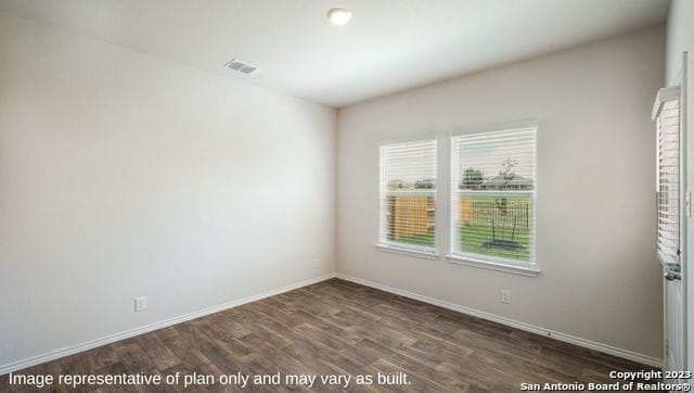 unfurnished room featuring dark hardwood / wood-style floors