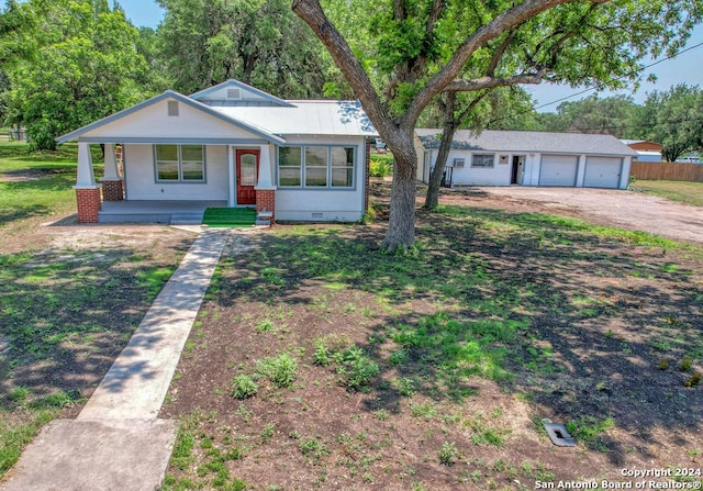 ranch-style home with covered porch