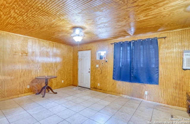 tiled empty room with wood ceiling and wooden walls