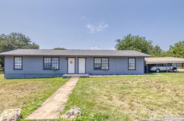 ranch-style house with a carport and a front lawn