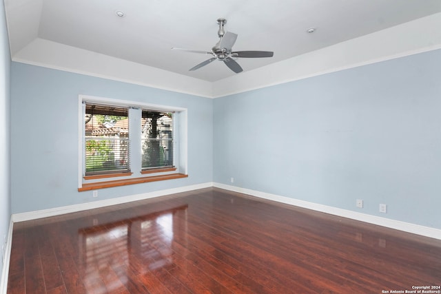 unfurnished room featuring dark wood-type flooring and ceiling fan