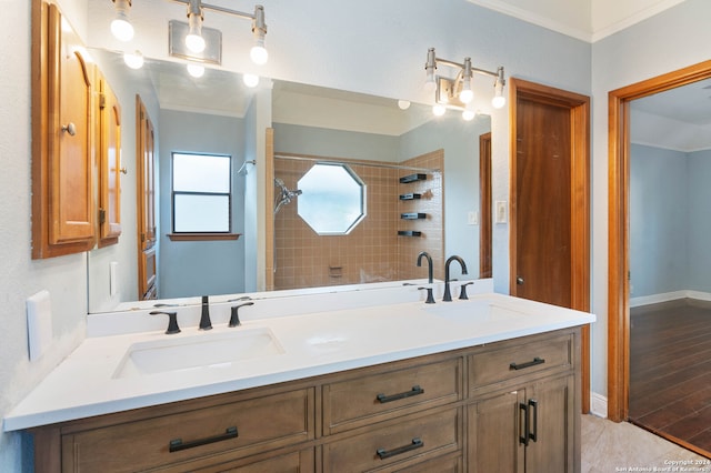 bathroom with hardwood / wood-style flooring, shower with separate bathtub, crown molding, and vanity