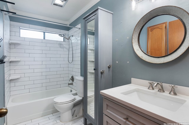 full bathroom featuring vanity, crown molding, toilet, tiled shower / bath, and tile patterned floors