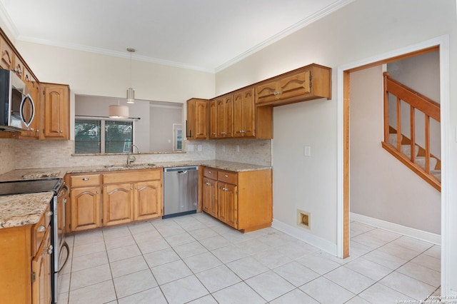 kitchen with light stone countertops, appliances with stainless steel finishes, tasteful backsplash, hanging light fixtures, and sink