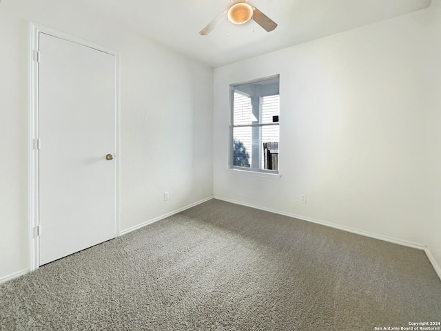 carpeted empty room with ceiling fan