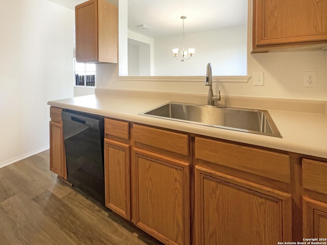 kitchen featuring light countertops, black dishwasher, dark wood-style floors, and a sink