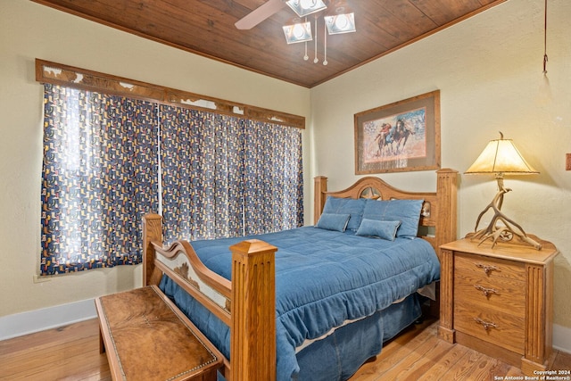 bedroom featuring wooden ceiling, crown molding, light wood finished floors, and ceiling fan