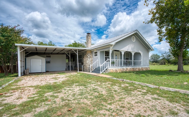 ranch-style house with a front lawn, a carport, and a porch