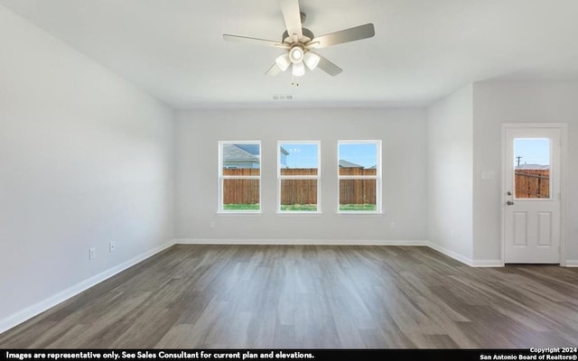 spare room with ceiling fan and hardwood / wood-style flooring