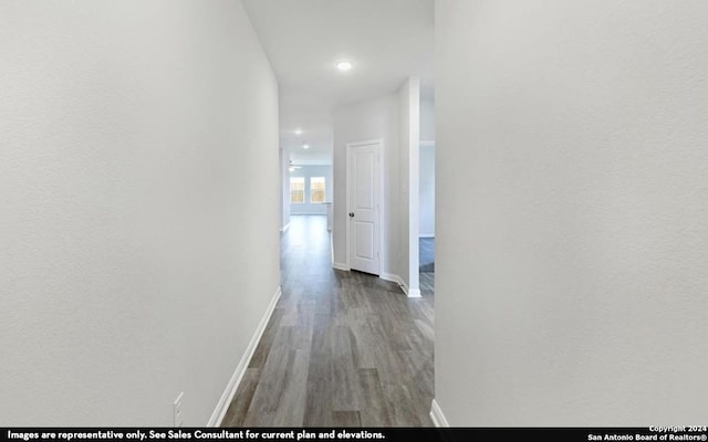 hall with wood-type flooring