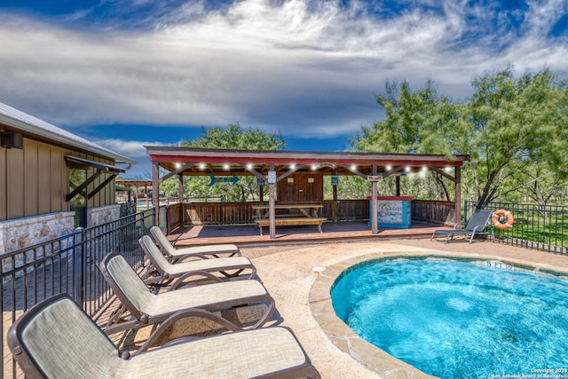 view of swimming pool with a patio area and a gazebo