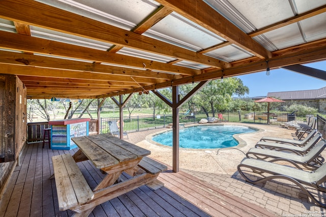 view of swimming pool featuring a wooden deck