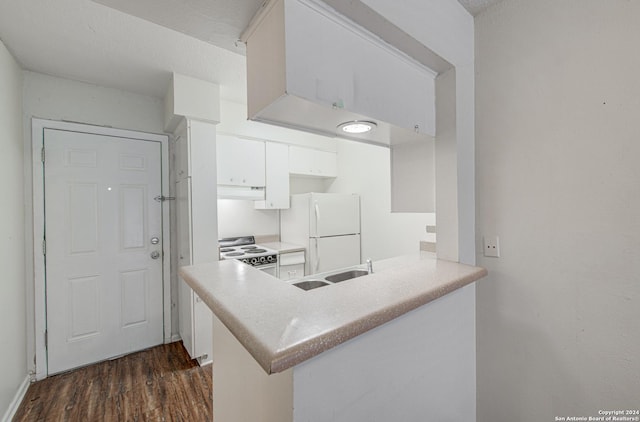 kitchen featuring under cabinet range hood, light countertops, dark wood-style floors, white cabinets, and white appliances