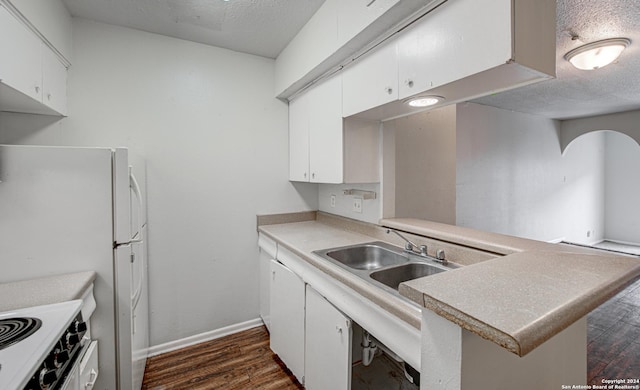 kitchen with dark wood-style floors, white cabinets, and a textured ceiling