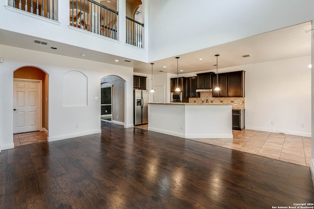 unfurnished living room featuring hardwood / wood-style flooring